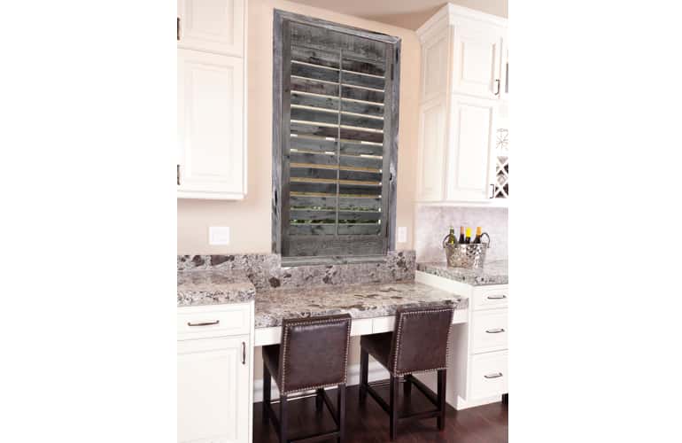 Kitchen window with reclaimed wood shutters in Phoenix